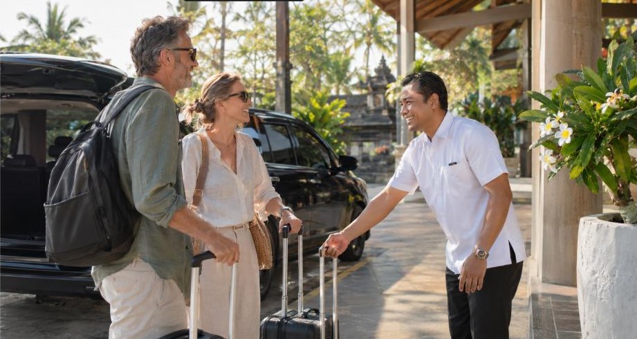 A private driver welcoming a couple at the airport in Bali